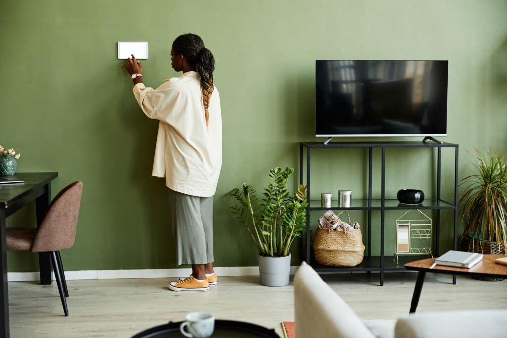 Young Woman Using Smart Home System